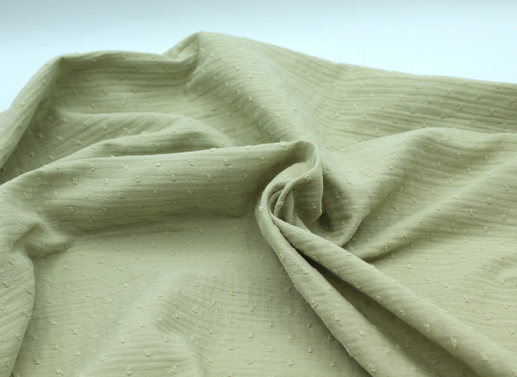 Double gaze de coton BIO plumetis vert amande