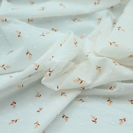 Plumetis de coton blanc pêche imprimé fleuri