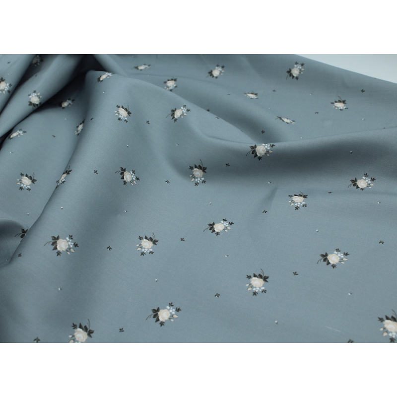 Coton satiné motif Lily exclusif Batikou fond bleu grisé