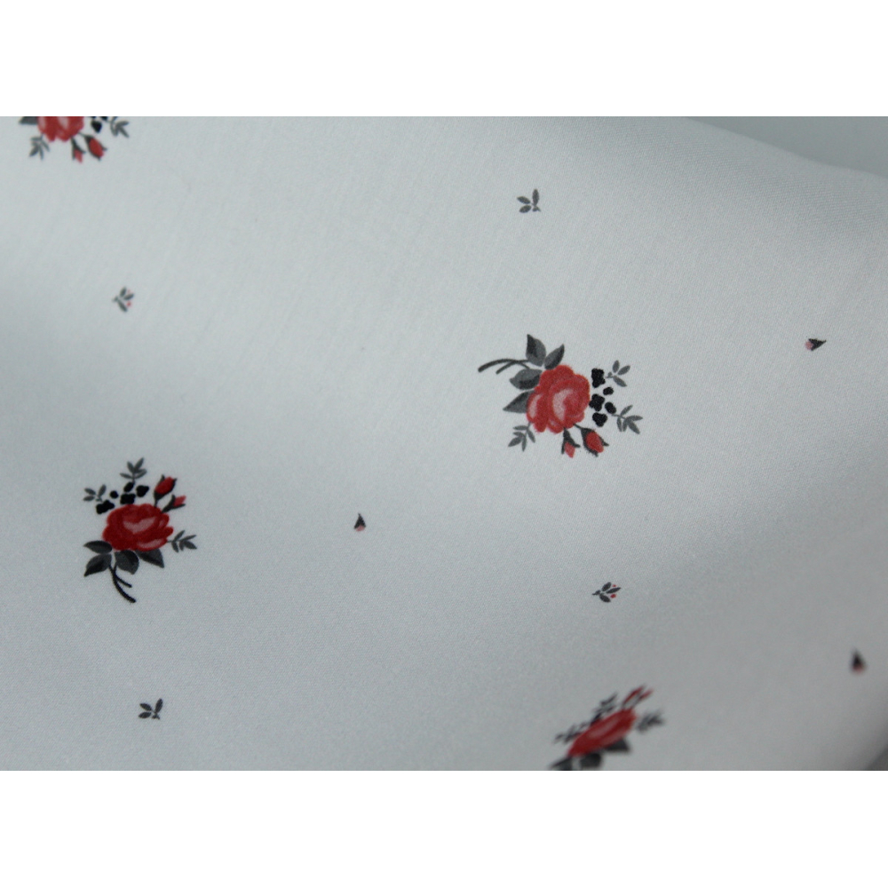 Coton satiné motif Lily exclusif Batikou fond blanc grisé