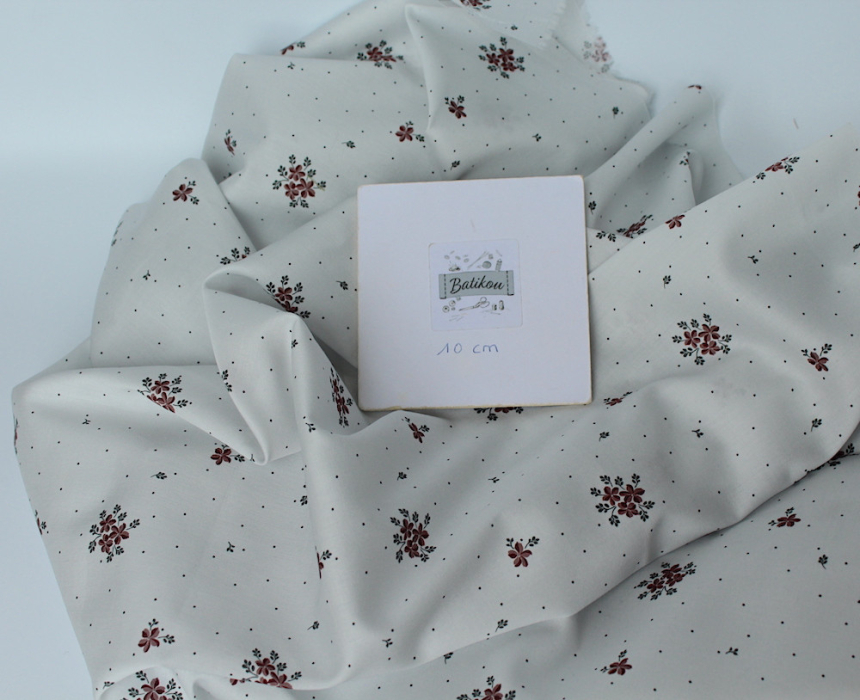 Coton satiné motif Beth exclusif Batikou fond pois gris x1m