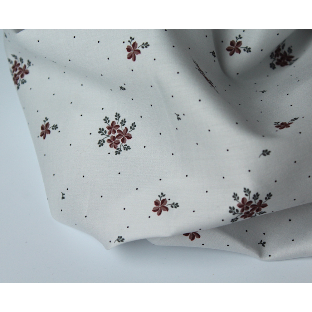 Coton satiné motif Beth exclusif Batikou fond pois gris x1m