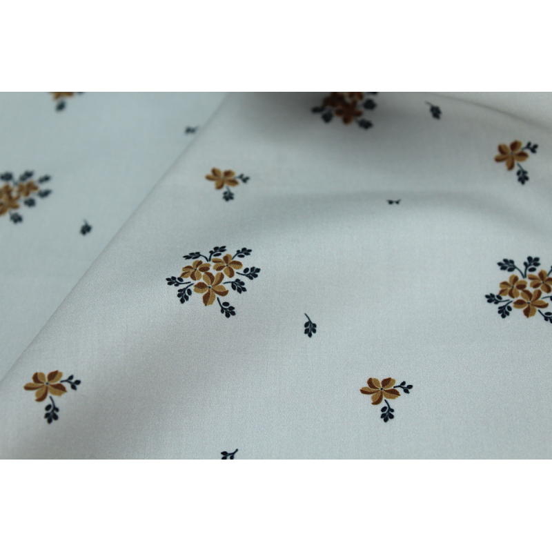 Coton satiné motif Beth exclusif Batikou fond uni gris perle x1m