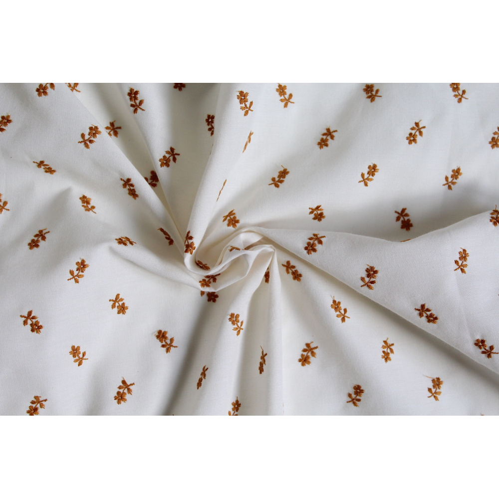 Tissu coton organique broderies fleurs moutarde