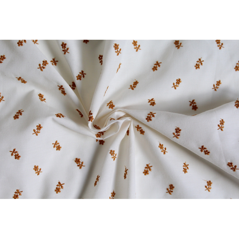 Tissu coton organique broderies fleurs moutarde
