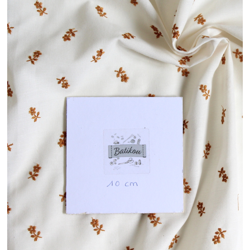 Tissu coton organique broderies fleurs moutarde