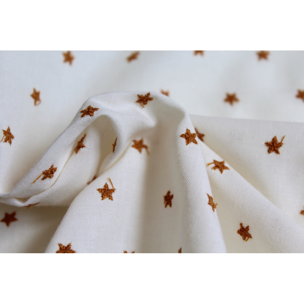 Tissu coton organique broderies étoiles moutarde
