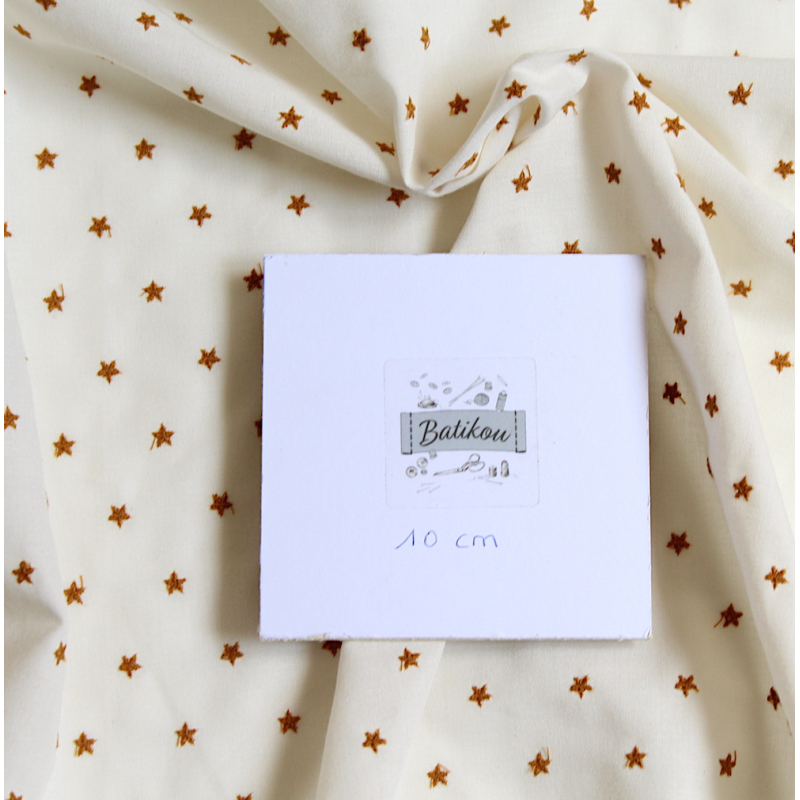 Tissu coton organique broderies étoiles moutarde