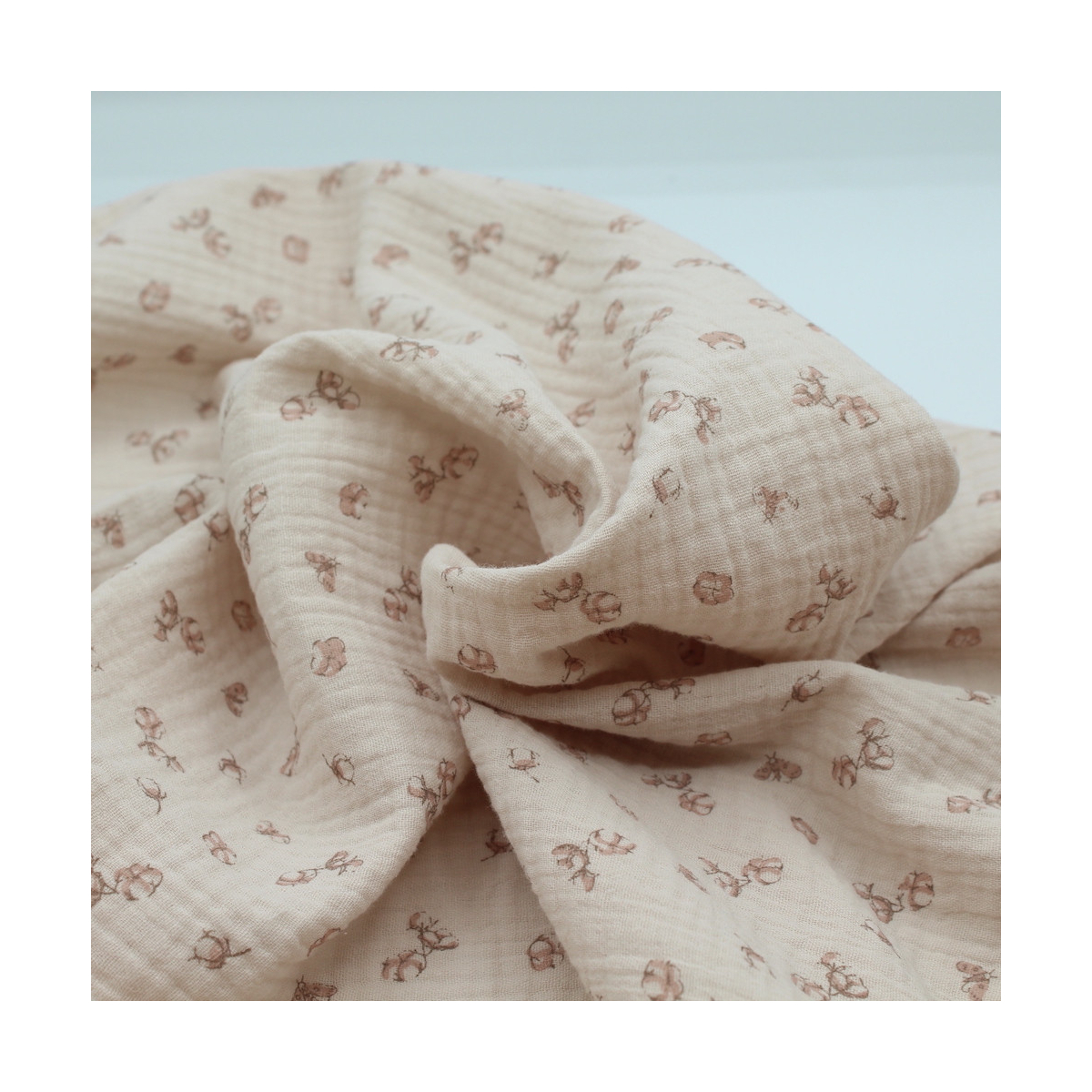 Double gaze de coton coloris nude naturel à motifs fleurs de coton Double gaze de coton coloris nude naturel à motifs fleurs de coton