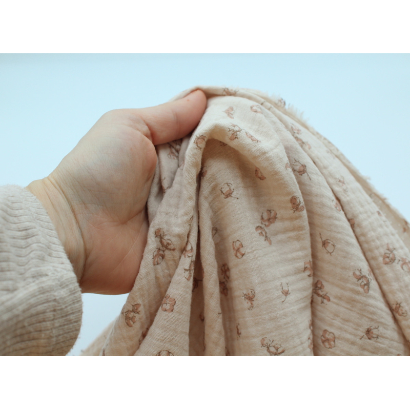 Double gaze de coton coloris nude naturel à motifs fleurs de coton