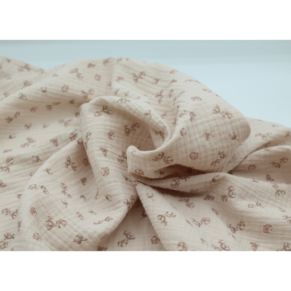 Double gaze de coton coloris nude naturel à motifs fleurs de coton