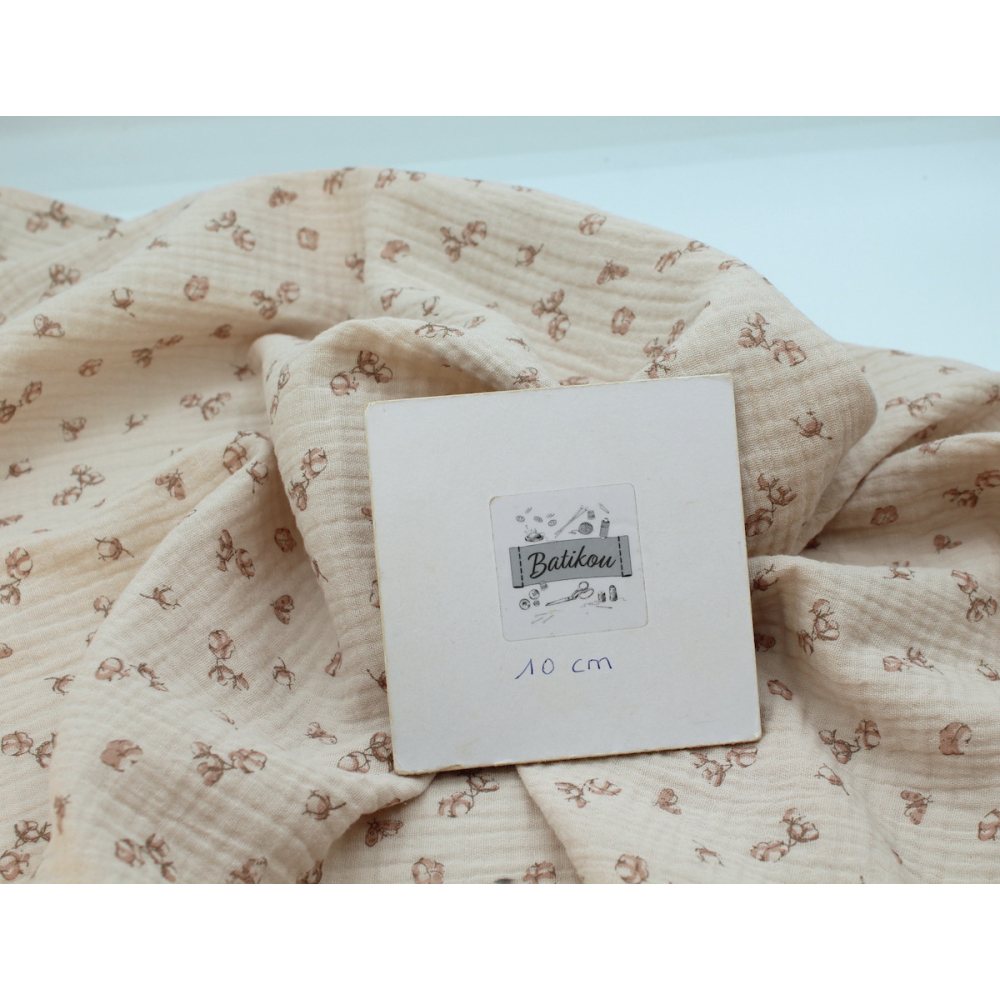 Double gaze de coton coloris nude naturel à motifs fleurs de coton