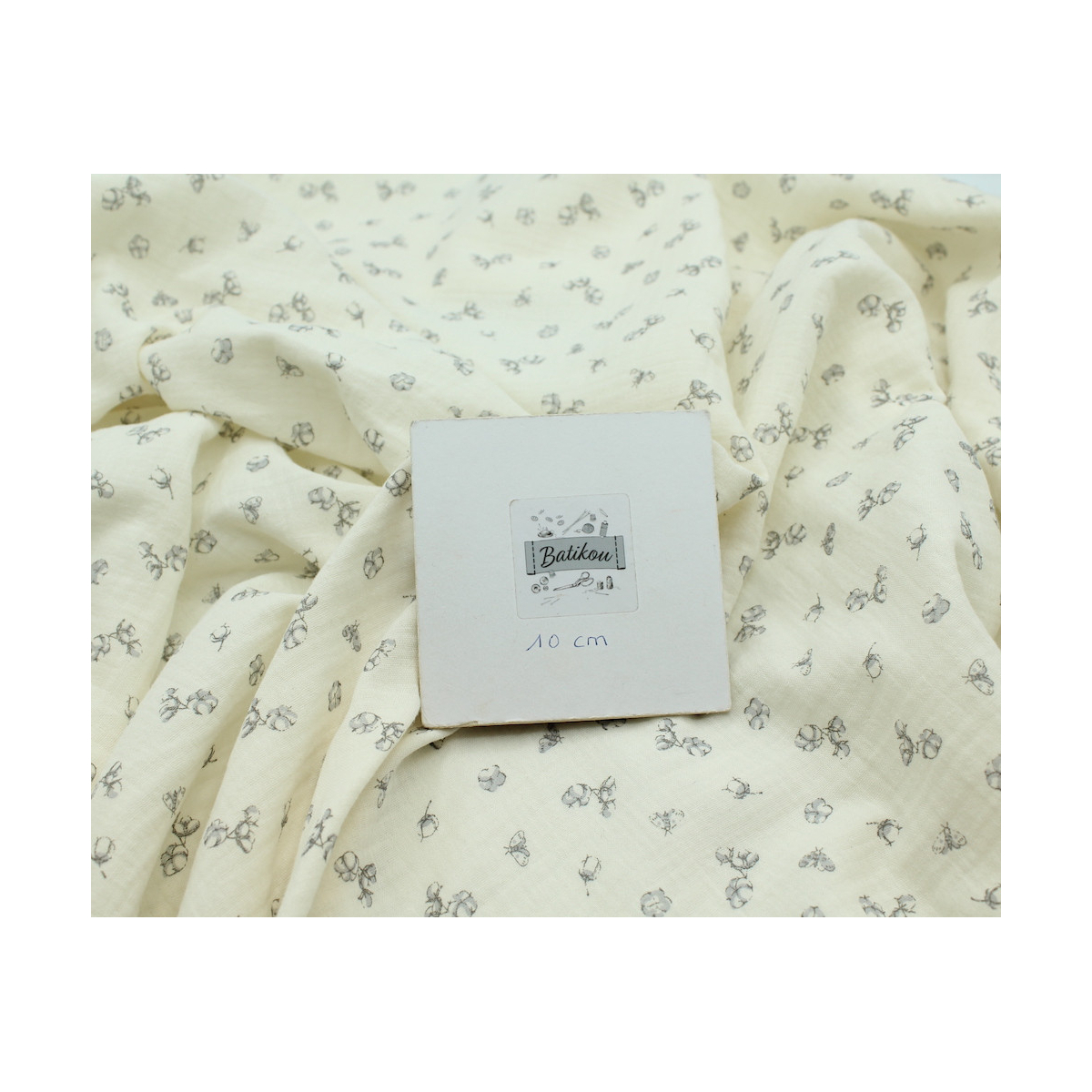 Double gaze de coton écru à motifs fleurs de coton Double gaze de coton écru à motifs fleurs de coton