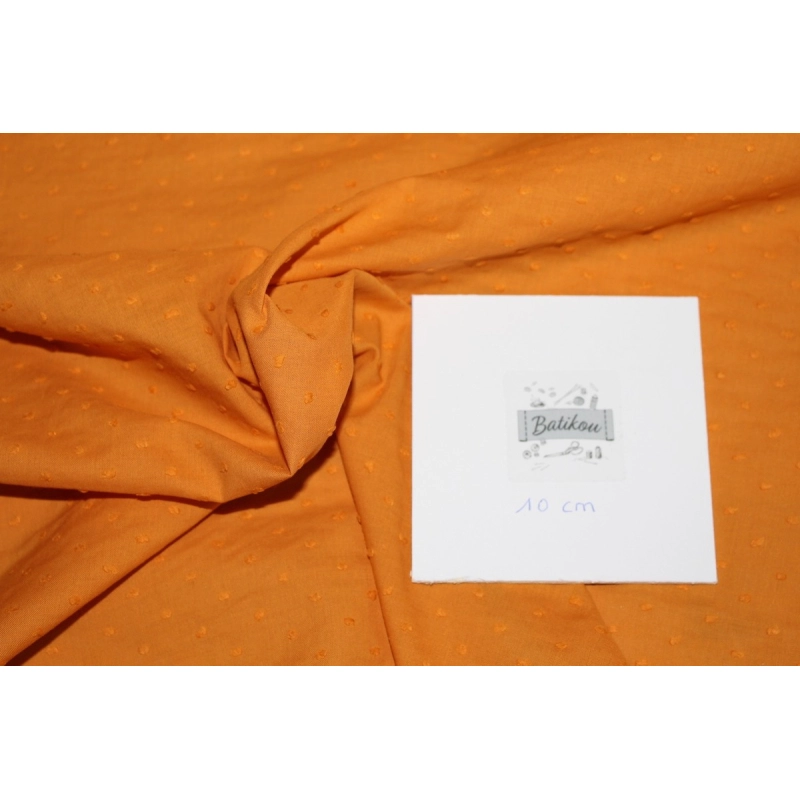 Plumetis de coton coloris clémentine