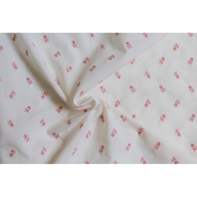 Tissu coton organique broderies fleurs rose