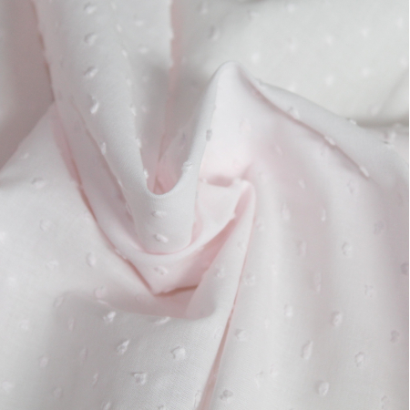Plumetis de coton coloris rose poudré