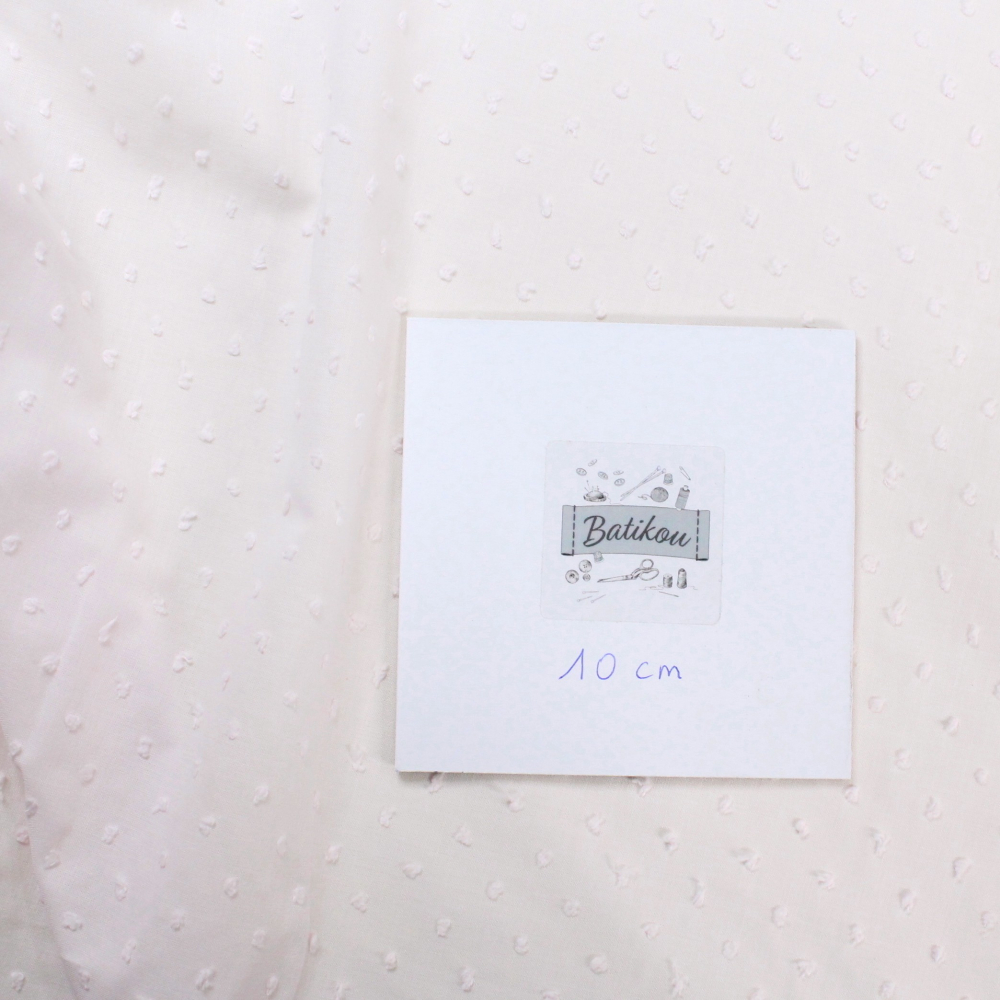 Plumetis de coton coloris rose poudré