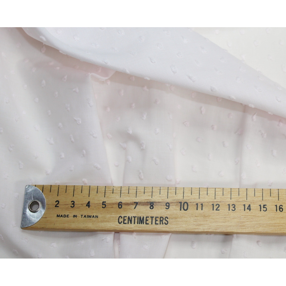 Plumetis de coton coloris rose poudré