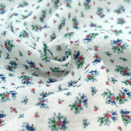 Lisette - Double gaze de coton blanc cassé à motifs petites fleurs bleues Tissus issus de l'agriculture biologique  - 1