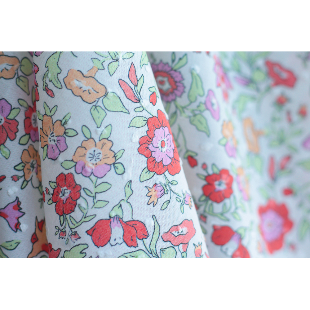 Léona - Plumetis de coton parme imprimé fleuri rouge orangé Tissus issus de l'agriculture biologique  - 11