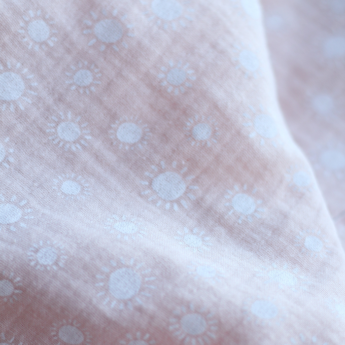 Solea - Double gaze de coton coloris fond rose nude motif soleil