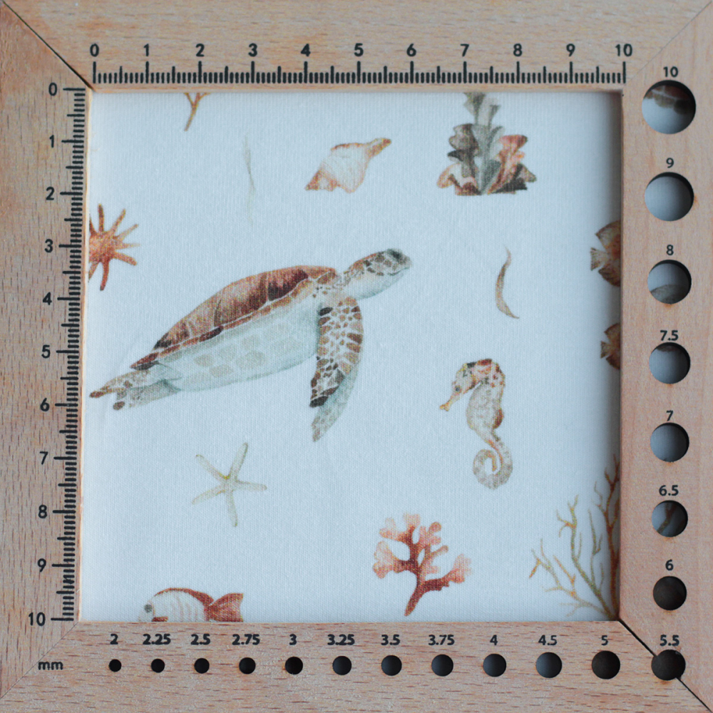 Jersey coton à motifs tortues ocre