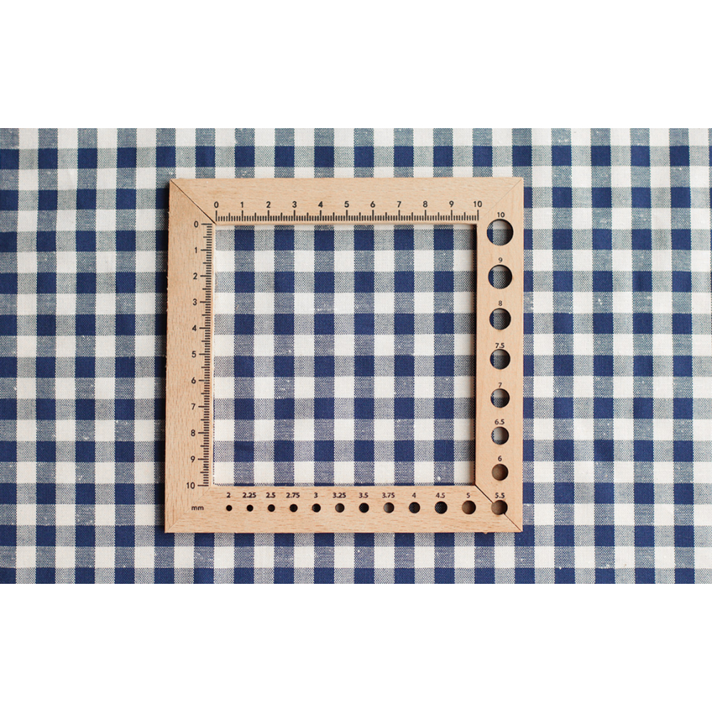 Coton chiné aspect brut vichy moyennes 7mm coloris bleu marine