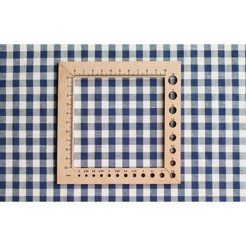 Coton chiné aspect brut vichy moyennes 7mm coloris bleu marine