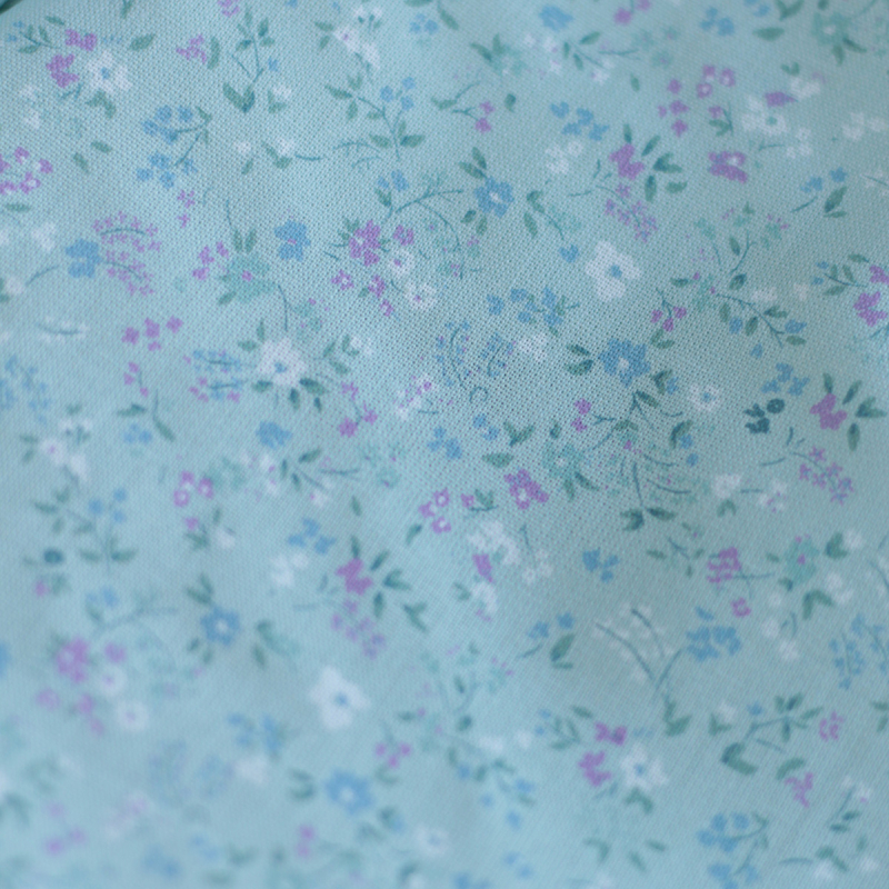 Ingrid - Popeline de coton BIO imprimé fleuri fond celadon