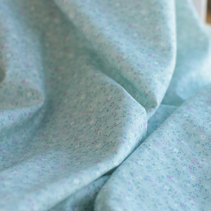 Ingrid - Popeline de coton BIO imprimé fleuri fond celadon
