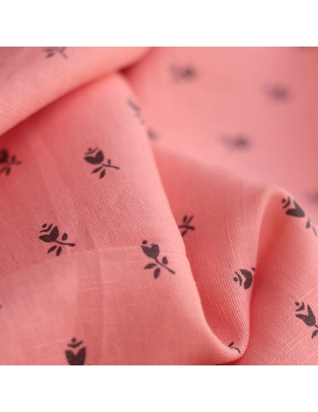 Lola - Tissu lin coton fond corail clair petits motifs noirs