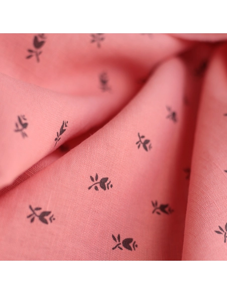 Lola - Tissu lin coton fond corail clair petits motifs noirs