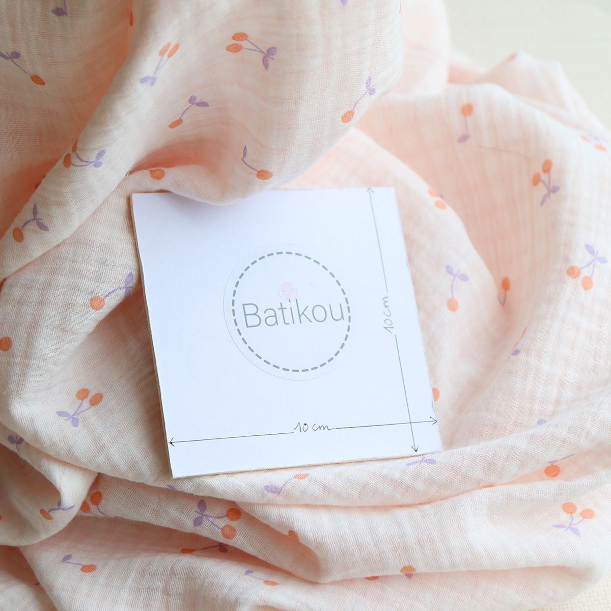 Cherry - Double gaze de coton double face coloris blanc cerises et quadrillage parme et orange