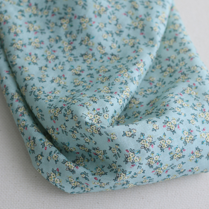 Lin et coton fond jade motif petit fleuri