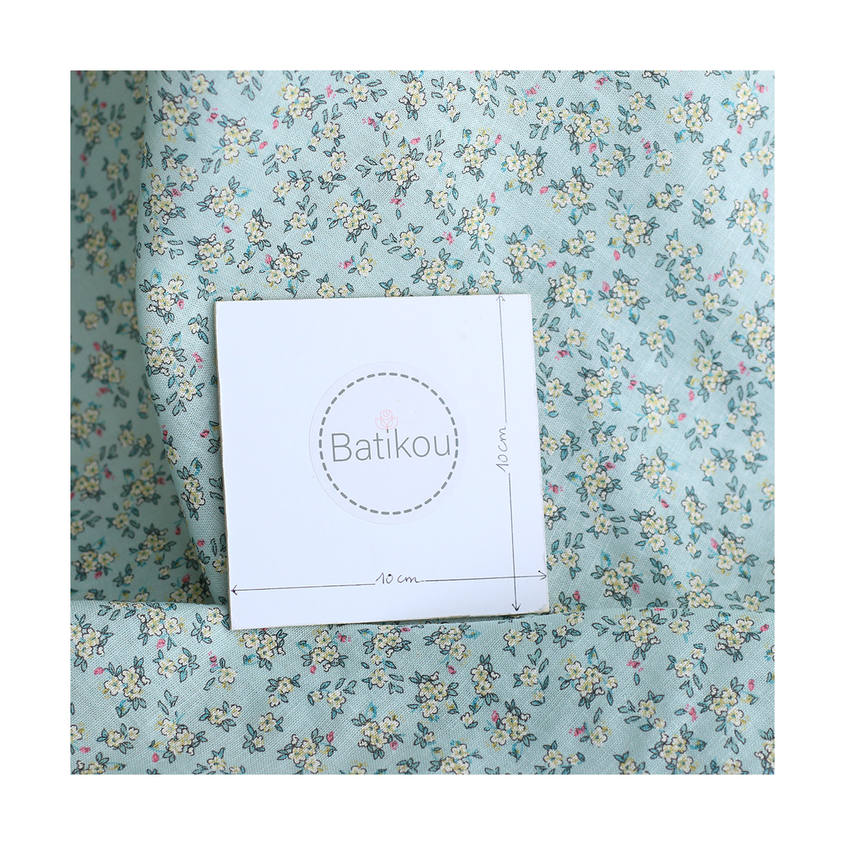 Lin et coton fond jade motif petit fleuri