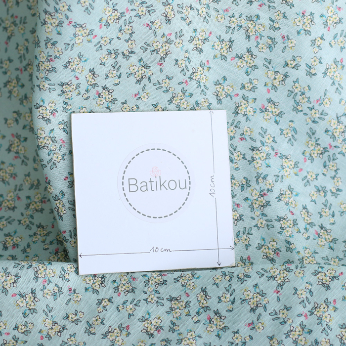 Lin et coton fond jade motif petit fleuri