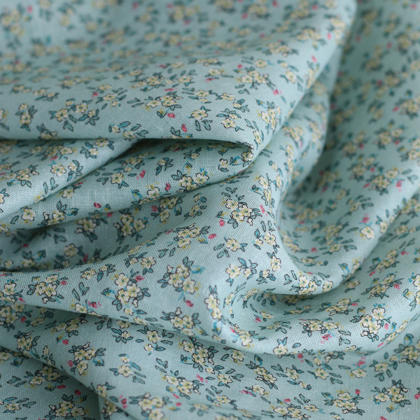 Lin et coton fond jade motif petit fleuri