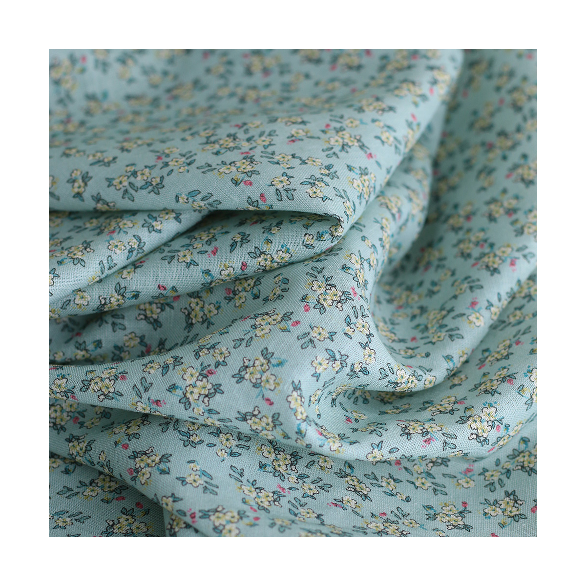 Lin et coton fond jade motif petit fleuri