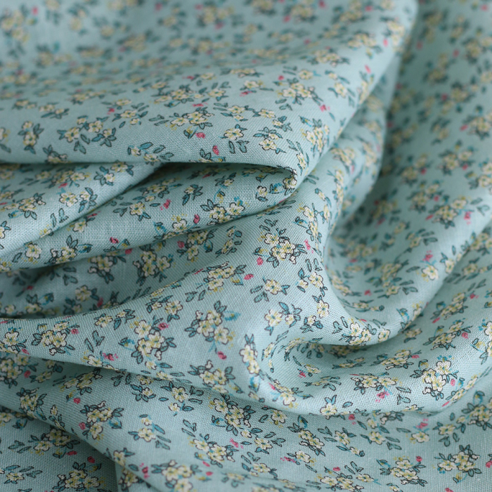 Lin et coton fond jade motif petit fleuri