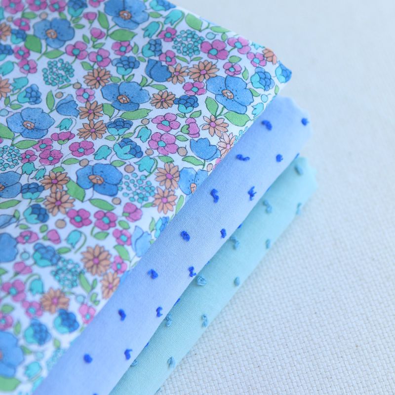 Plumetis de coton bicolore bleu ciel / bleu roi