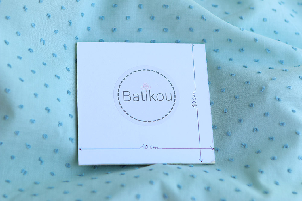 Plumetis de coton bicolore vert d'eau