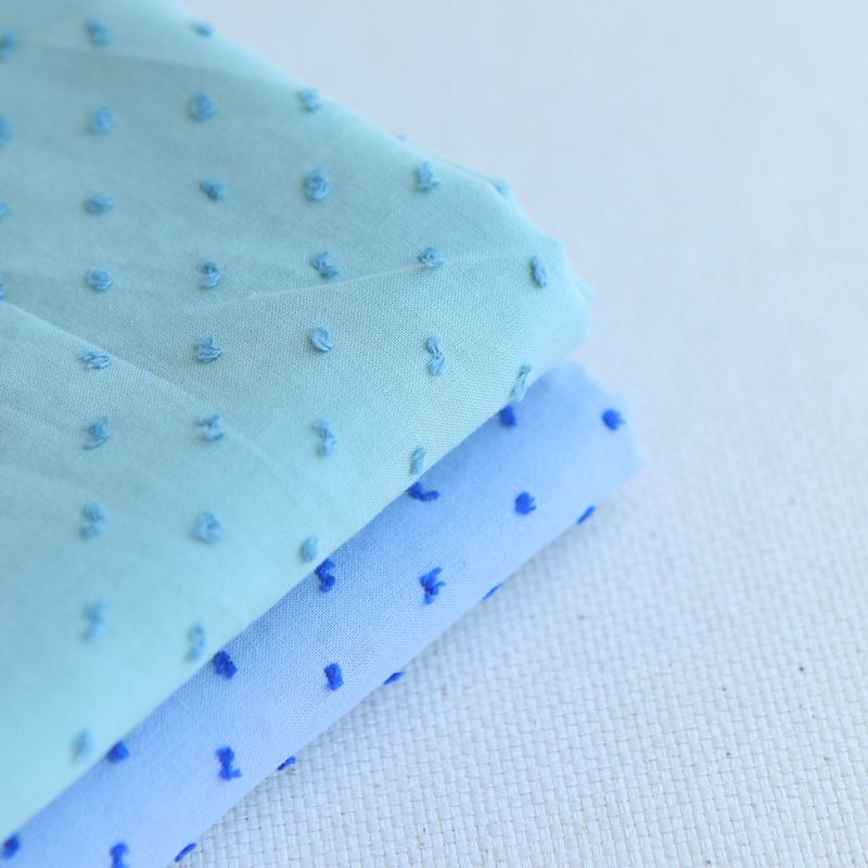 Plumetis de coton bicolore vert d'eau