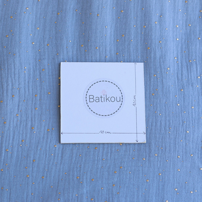 Double gaze de coton pois dorés fond bleu nuage