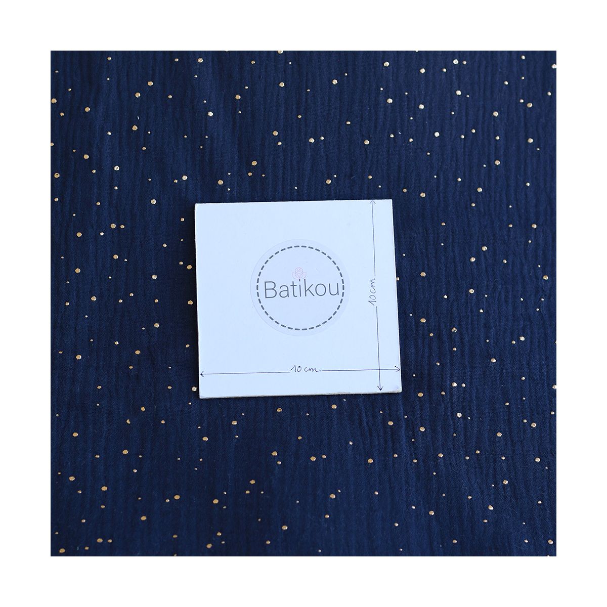 Double gaze de coton pois dorés fond bleu marine