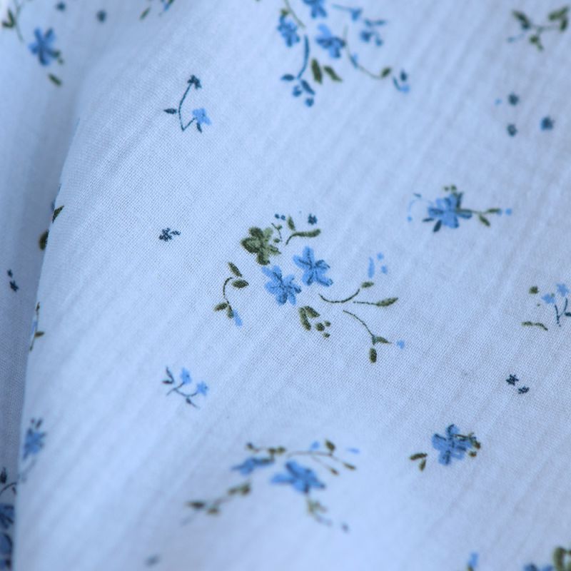 Sofia - Double gaze de coton motif fleuri fond bleu ciel