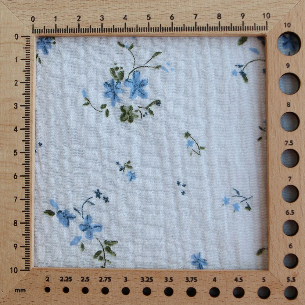 Sofia - Double gaze de coton motif fleuri fond bleu ciel