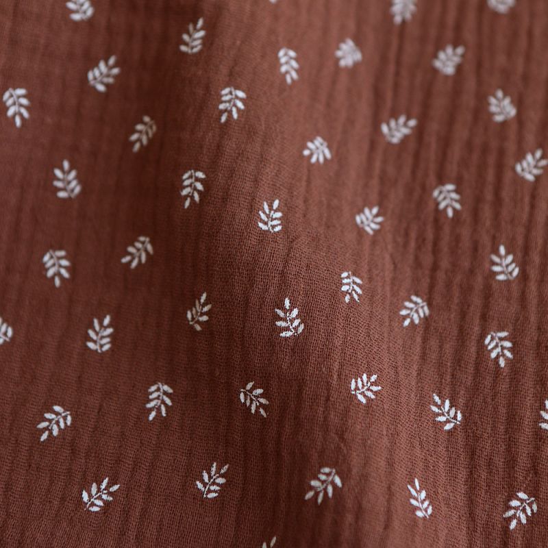 Sacha - Double gaze de coton motif feuilles fond noisette