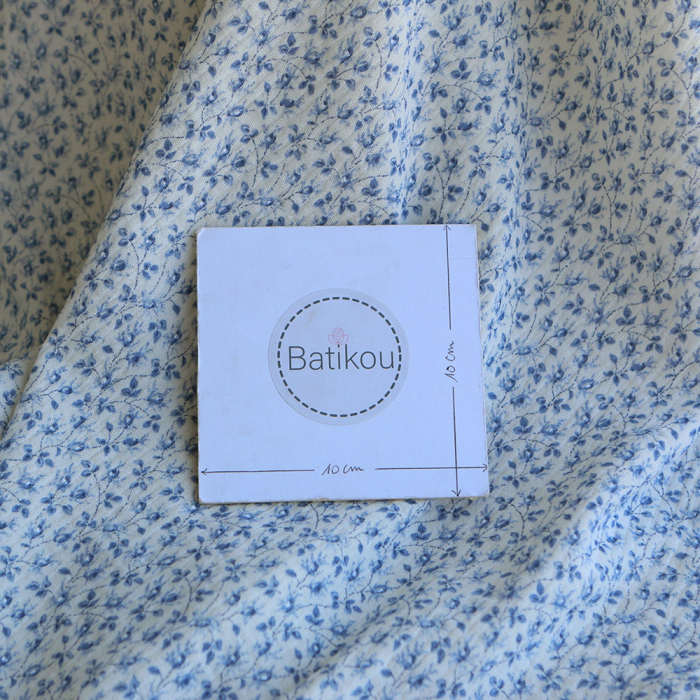 Harper - Double gaze de coton motif fleuri bleu fond écru