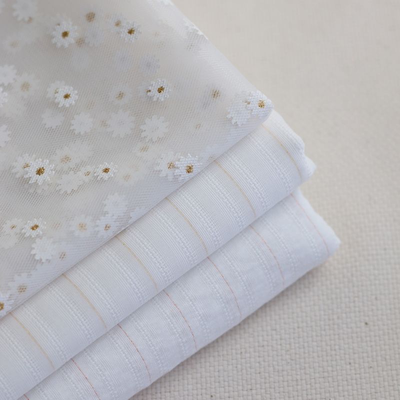 Tissu coton texturé / jacquard lurex métallisé doré