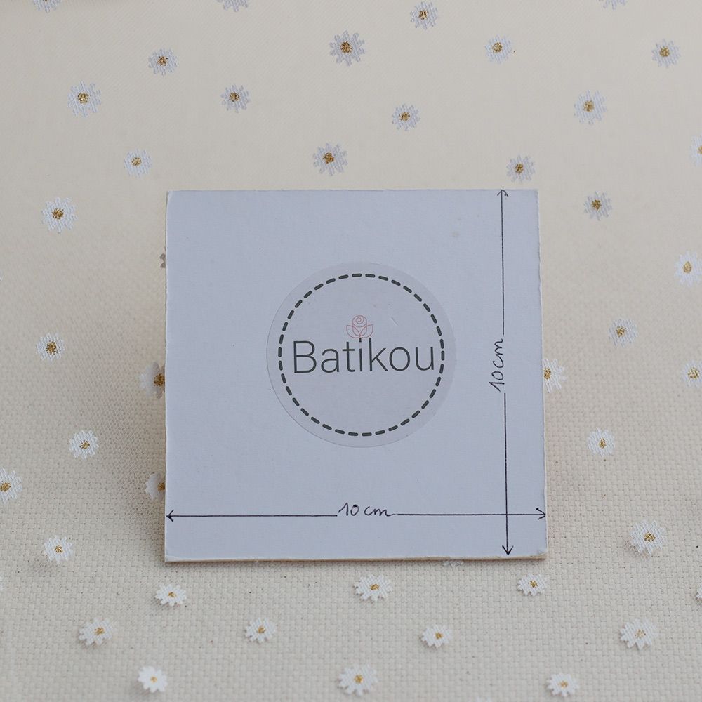 Tulle blanc petites marguerites dorées